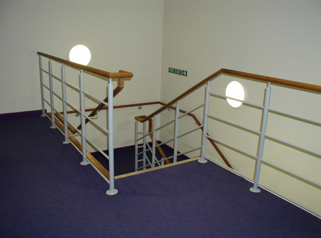 Wooden handrails with steel balustrade stair infills