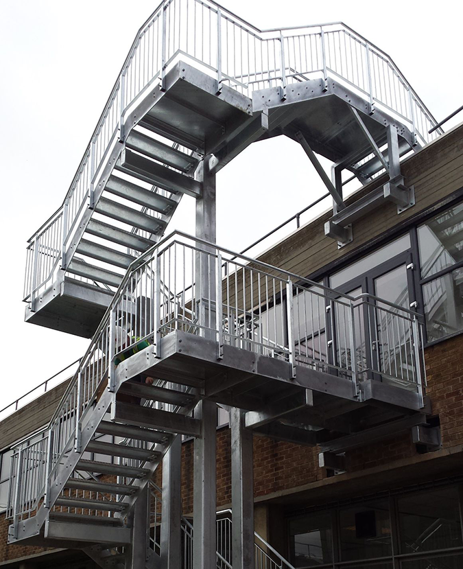 An outdoor square spiral staircase manufactured by Gatehouse Architectural